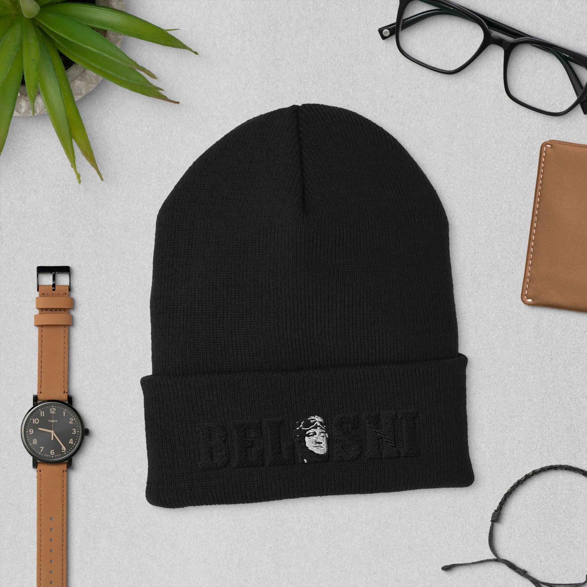 Belushi Beanie in black featuring an embroidered patch, perfect for comedy fans.