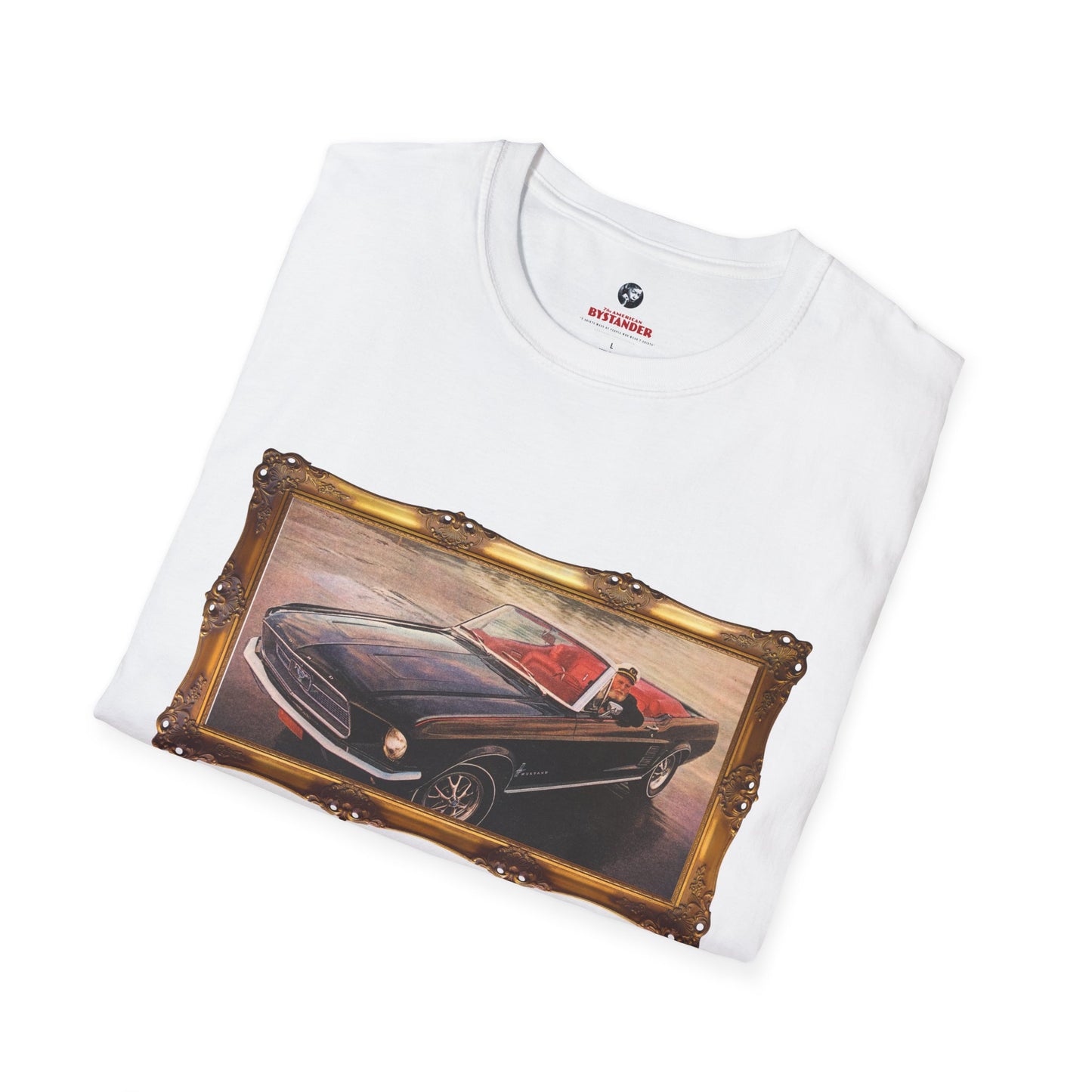 White T-shirt neatly folded to display the central design of a sea captain driving a Mustang within a vintage-style frame.