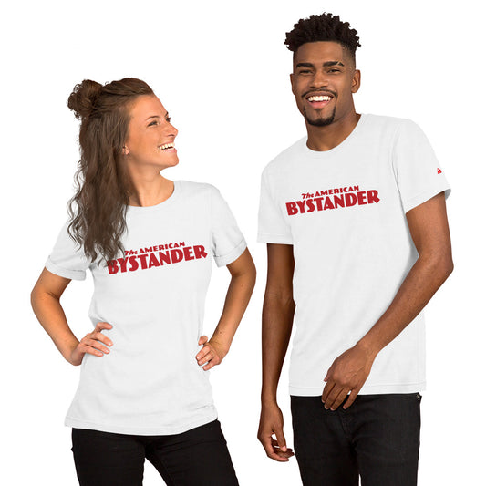 Young couple in their twenties, both wearing stylish American Bystander T-shirts, smiling with an air of joyful camaraderie.