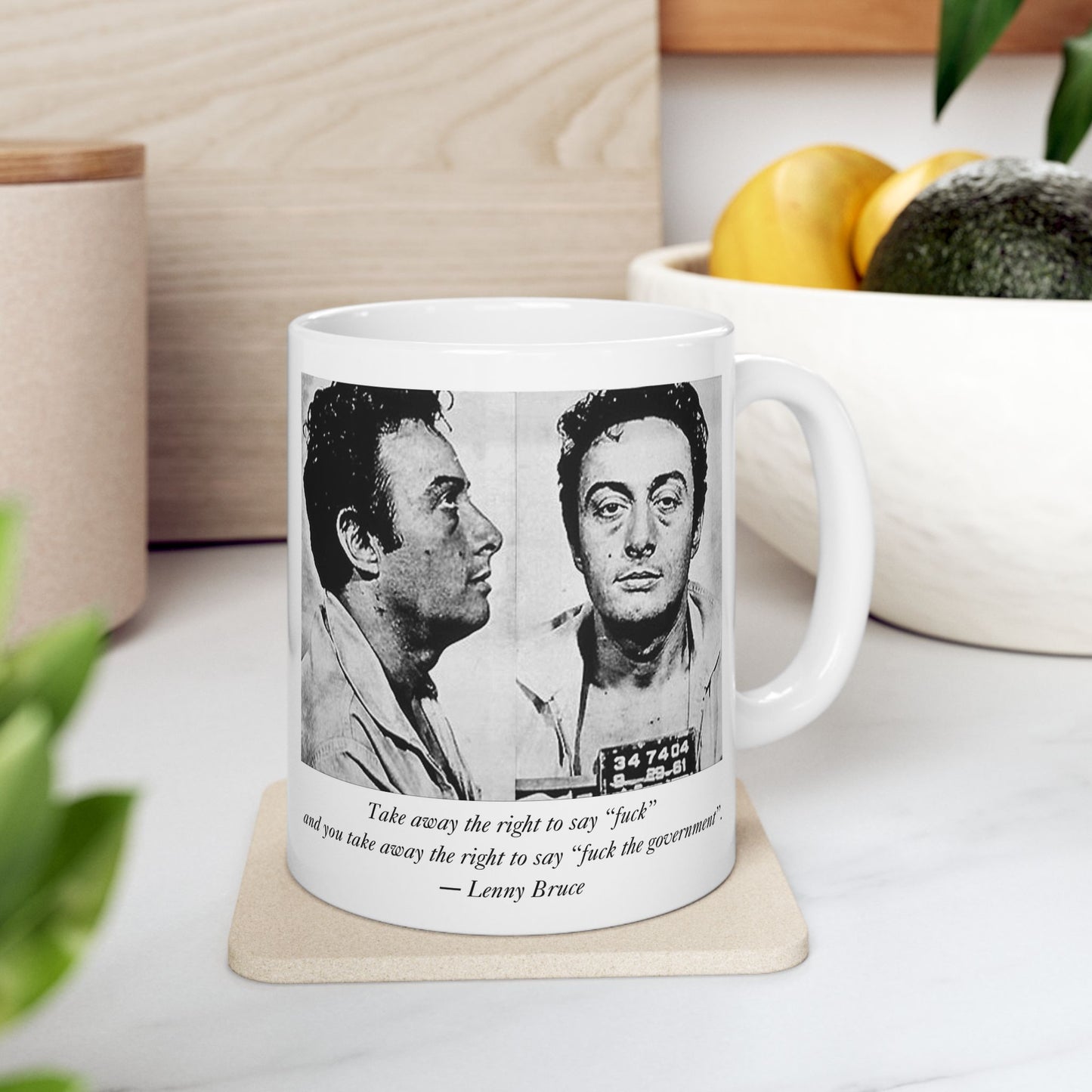 Lenny Bruce mug on a kitchen counter with a minimalist background, featuring his mugshot and free speech quote.